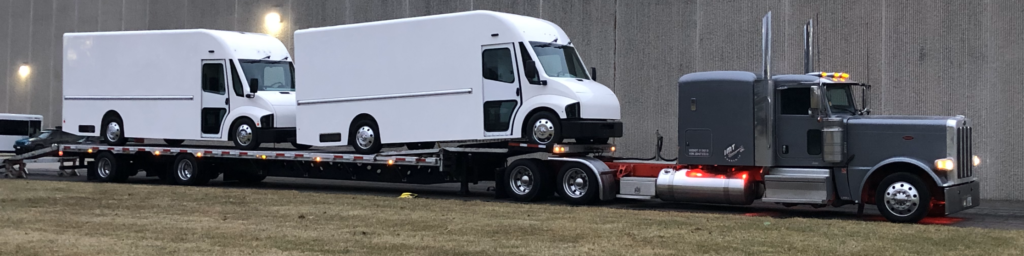 "Revolution in Motion: Two 10-foot-tall EVs successfully loaded—what looks routine is actually a breakthrough in EV logistics, achieved with a custom-built trailer in just two months."